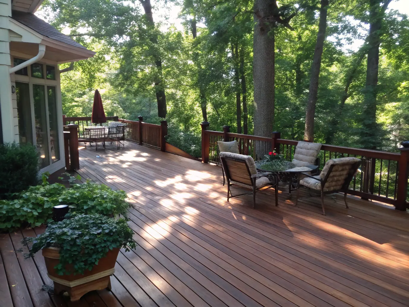 A wooden deck being power washed, showing the removal of moss and stains. The deck is part of a backyard with lush greenery.